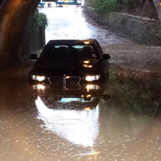 Car in flood Milkingpen Lane - Jan 2014 © Tony Tuck