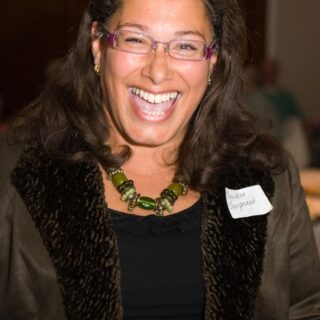 Daurisa Bergeaux smiling for a photo at the Basinga’s 35th anniversary celebration.
